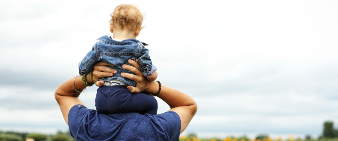 Dad holding a boy