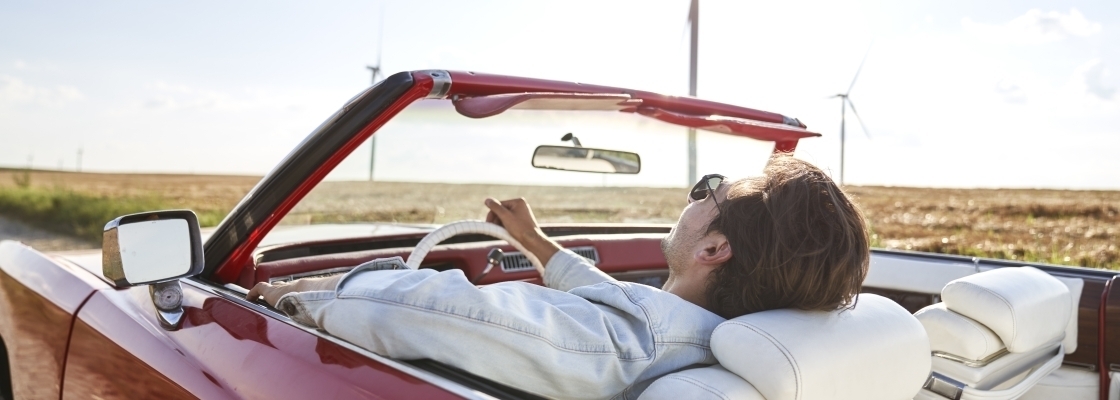 Man relaxing in car